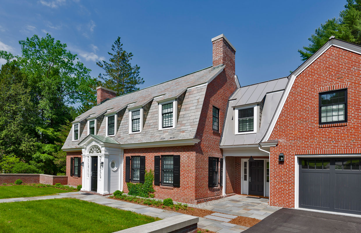large brick house on a blue sky day