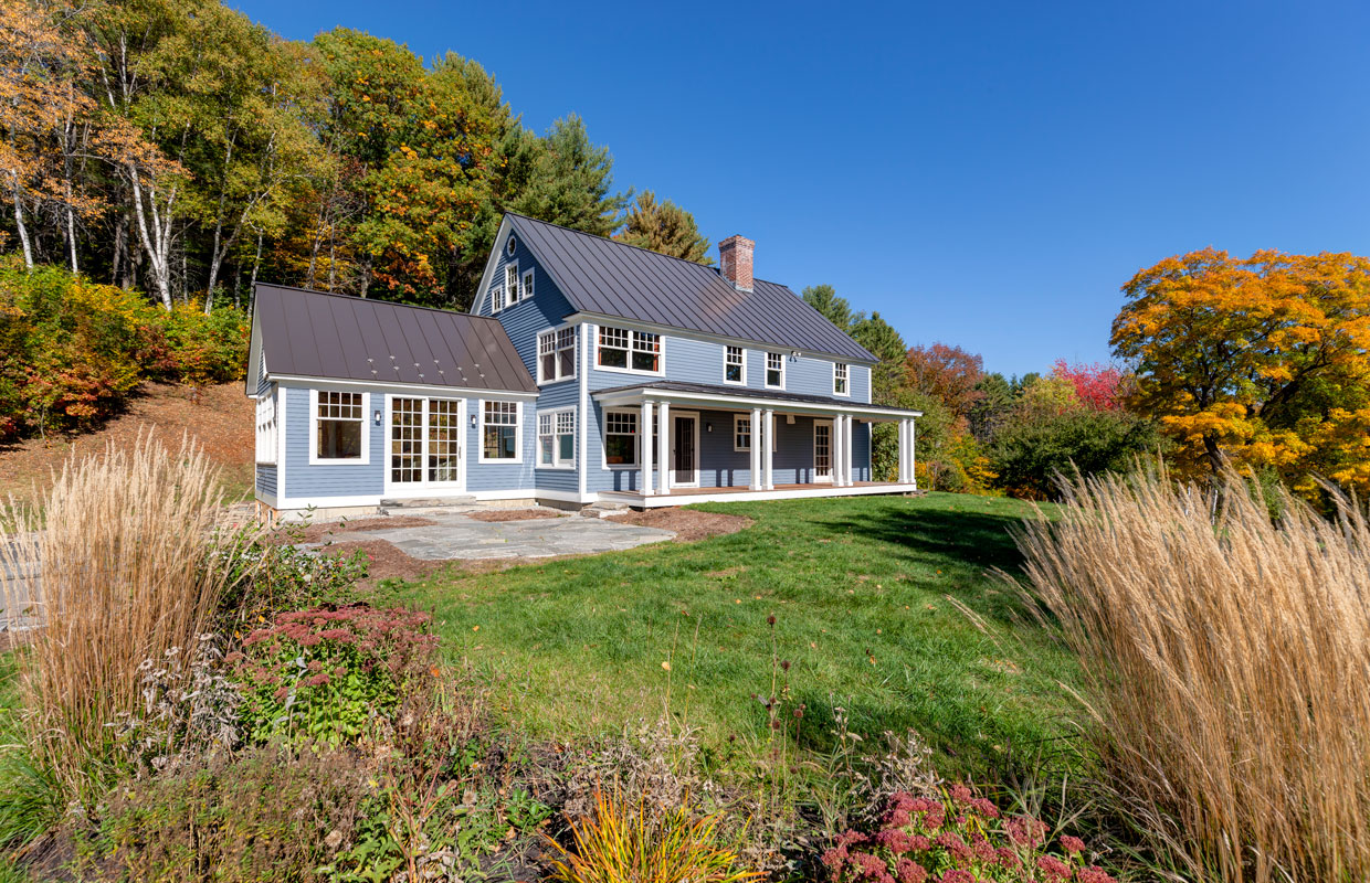 blue house with a farmer's porch