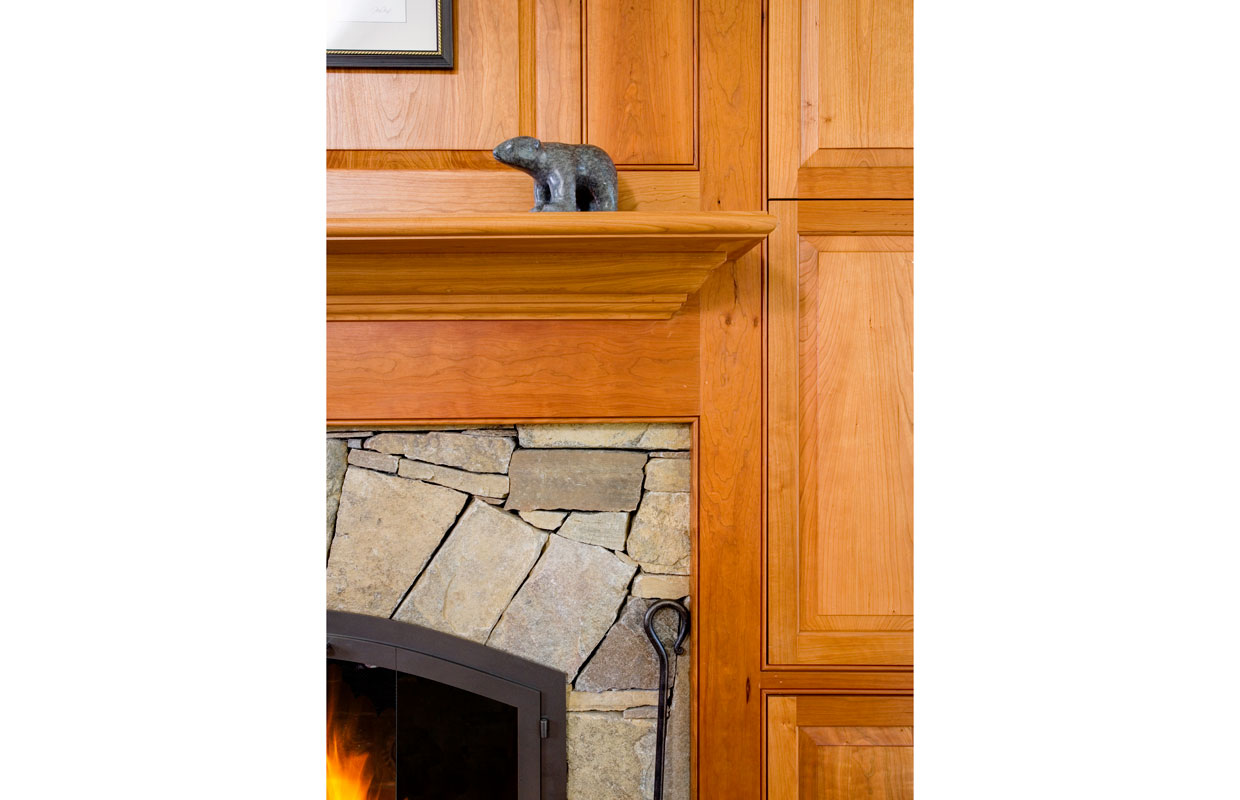 detail of wood molding around a fireplace