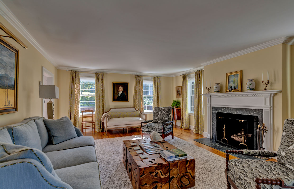 large family room with a fireplace and coffee table
