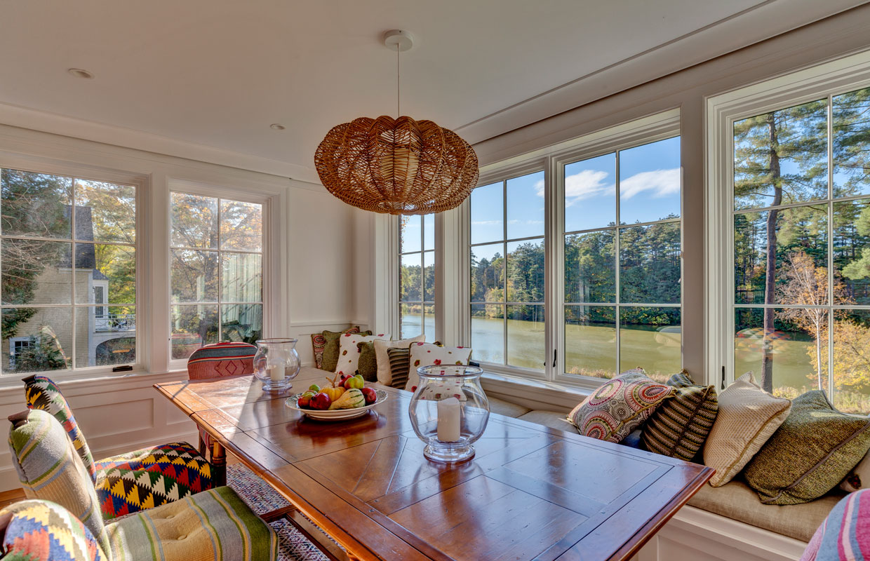 dining room with wrap around windows