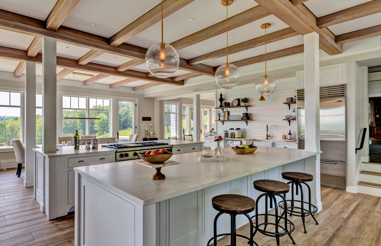 large kitchen with wrap around windows, exposed beams and lots of light