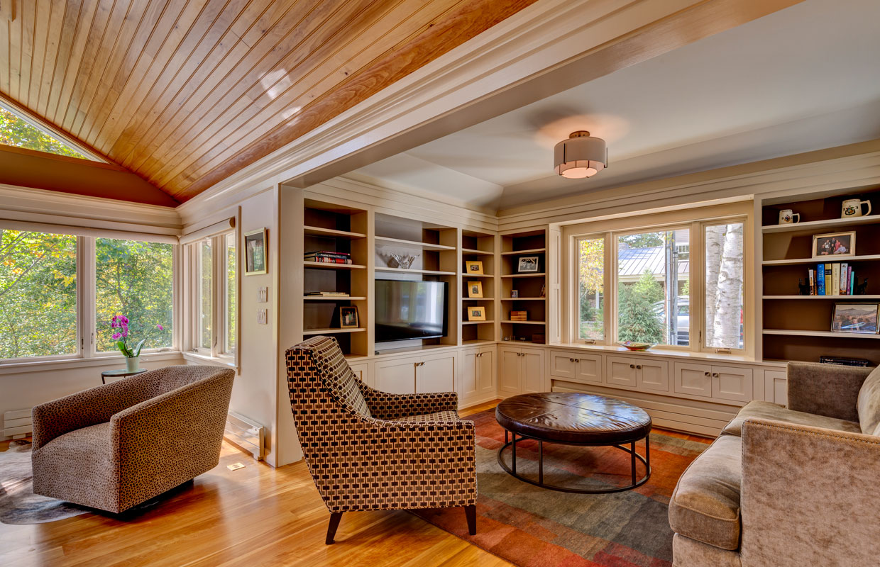 reading room with a round coffee table and upholstered armchairs