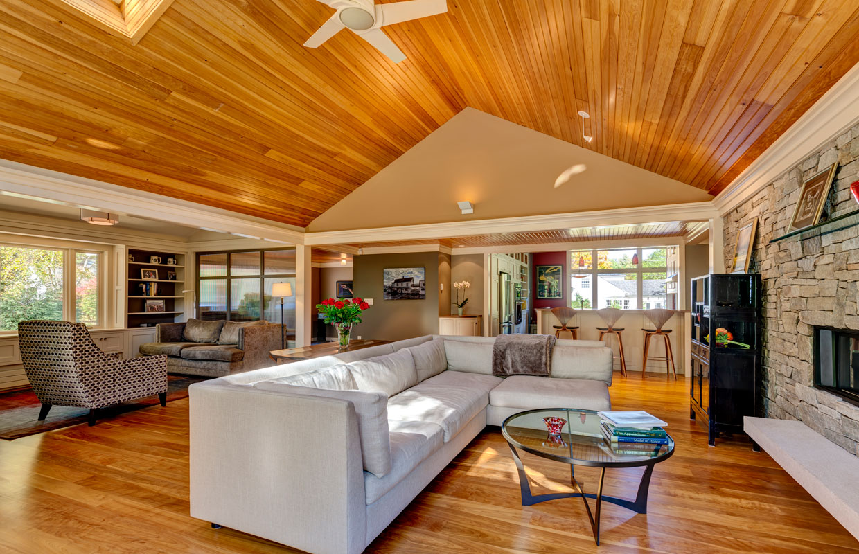 great room with a-frame ceiling and hardwood floors