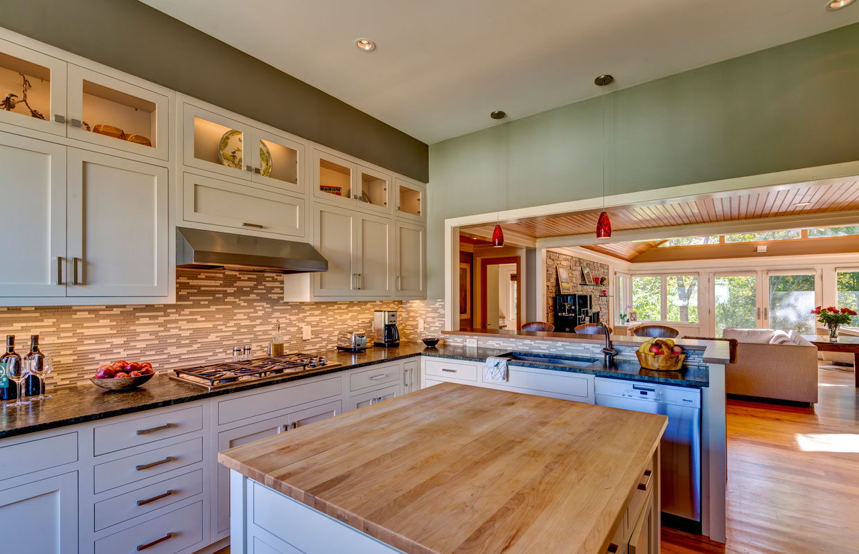 kitchen with tile backsplash and green walls