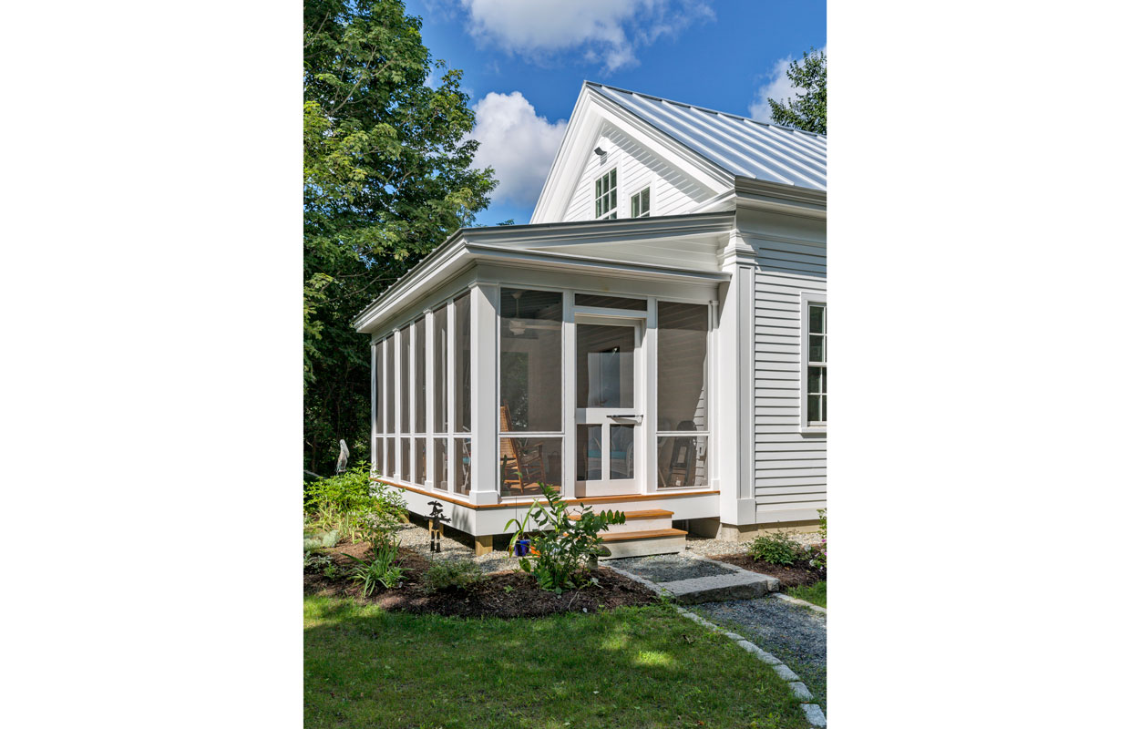 3 season porch on a white house view from the outside