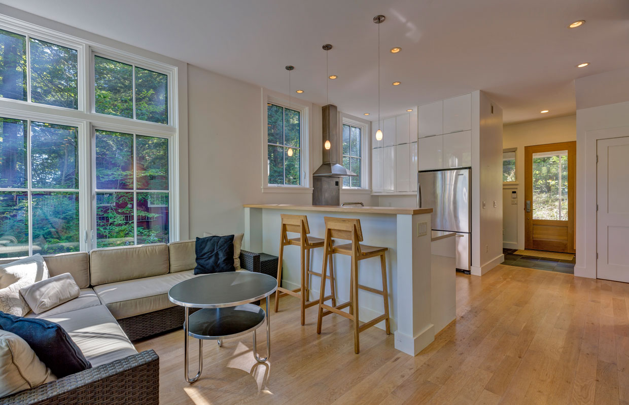 view into a kitchen looking over a breakfast bar