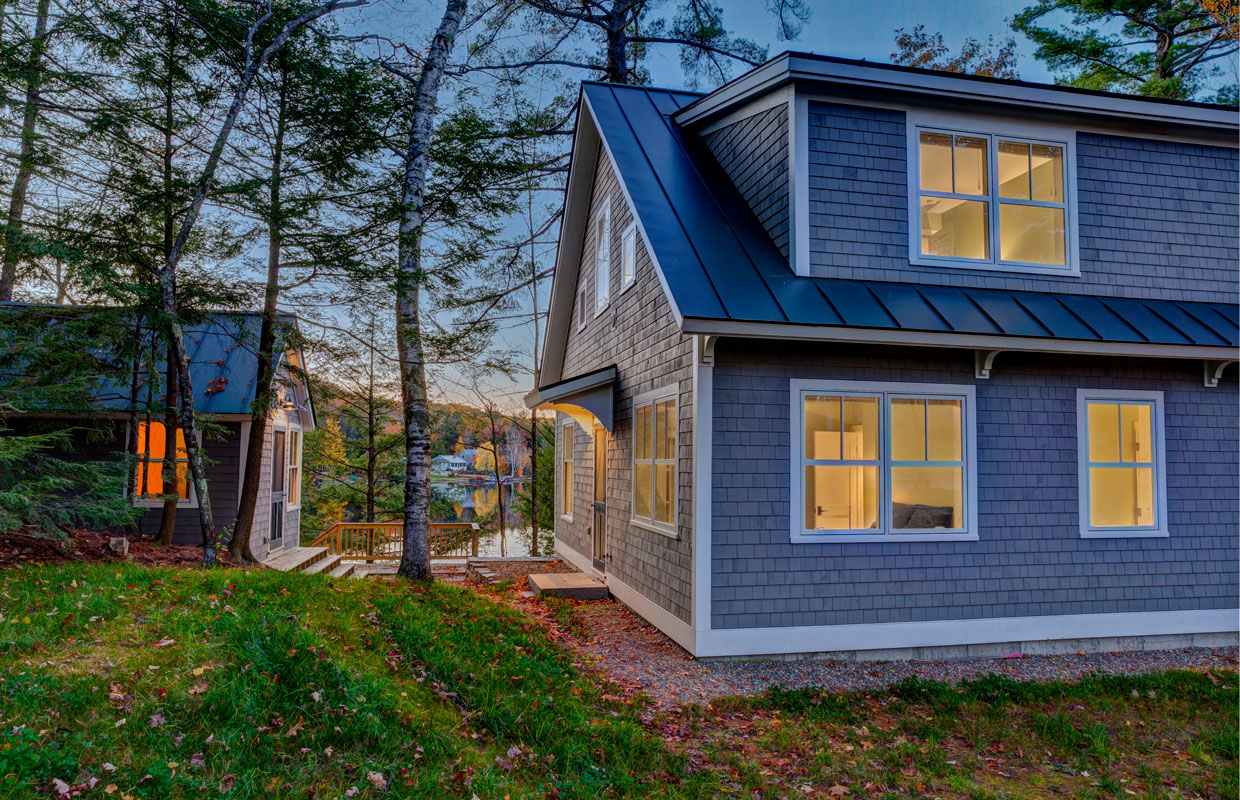 gray cottage and boathouse