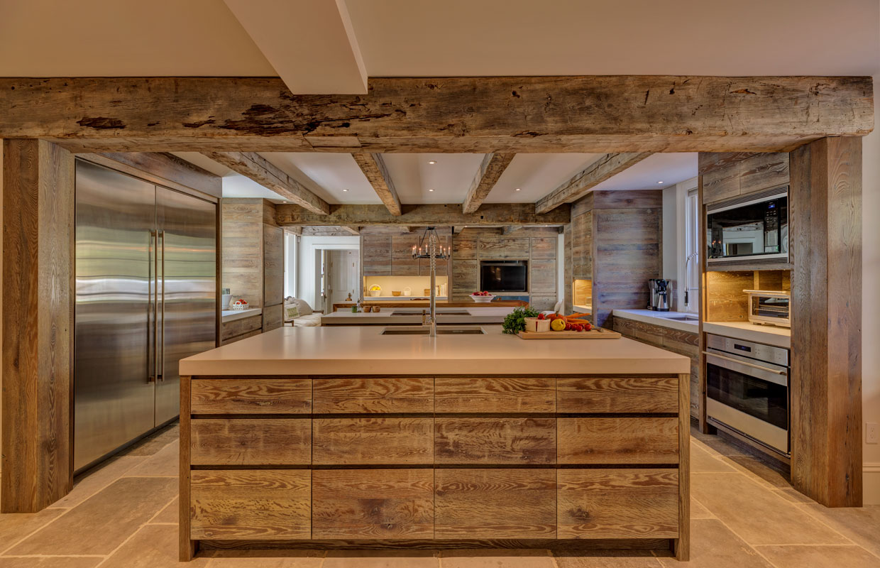 large kitchen with a massive stainless steel refrigerator and island