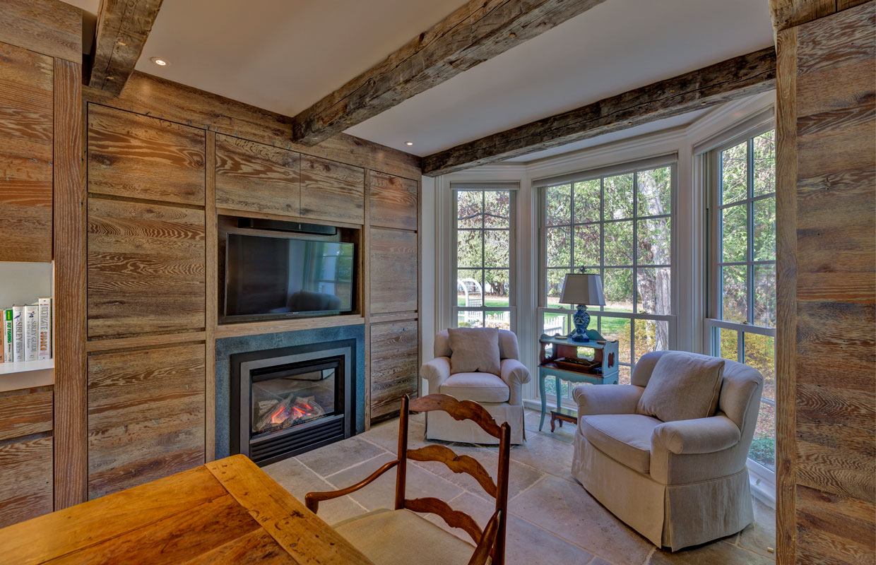 fireplace on a wall with weathered wood accents