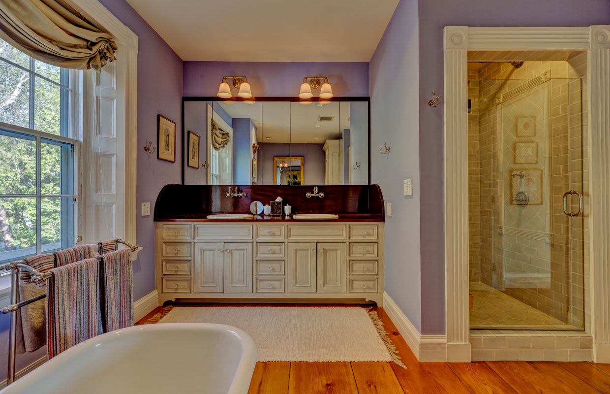 large white vanity in a purple bathroom