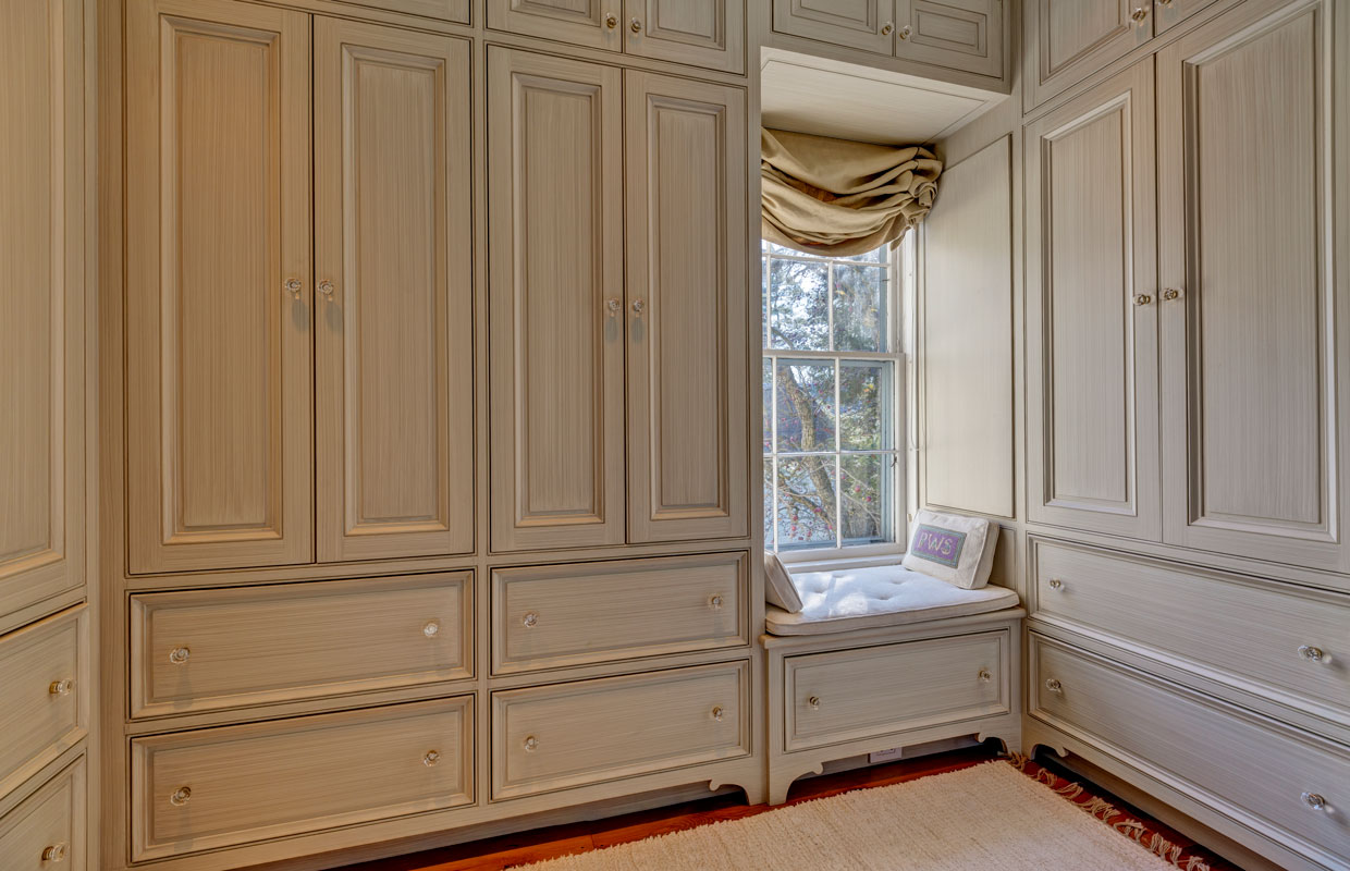 detail view of a weathered white cabinet in a bedroom