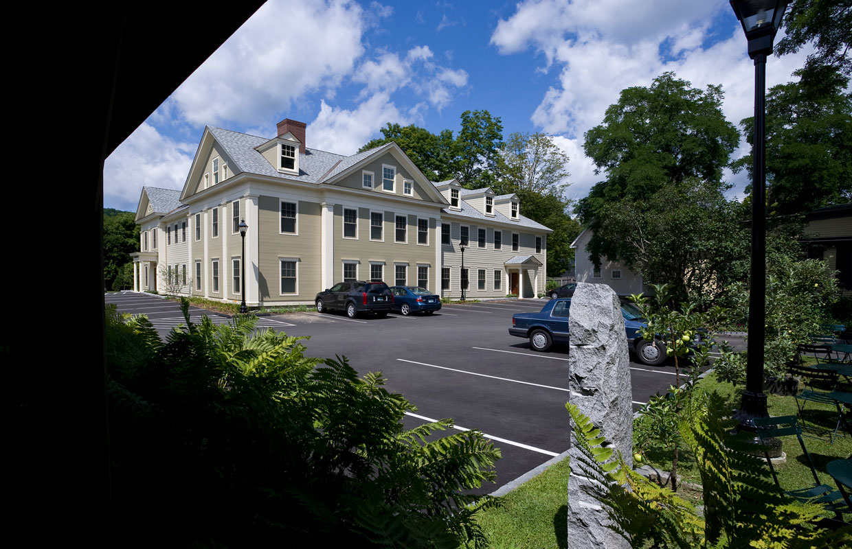 large tan building and parking lot