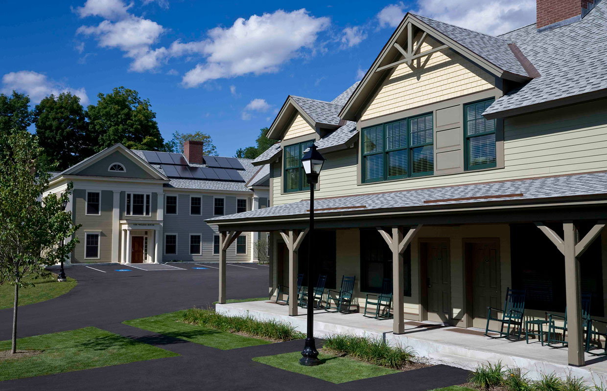 tan building with a farmer's porch