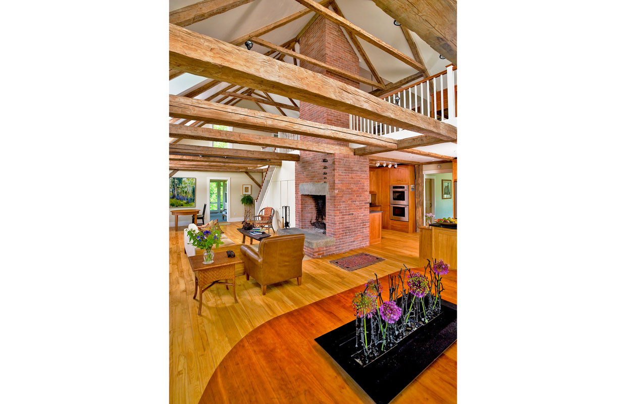 large living room area with fire place and tall ceilings