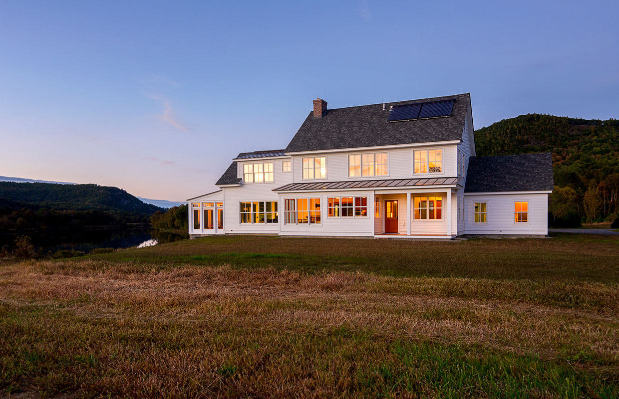 white farmhouse in a field