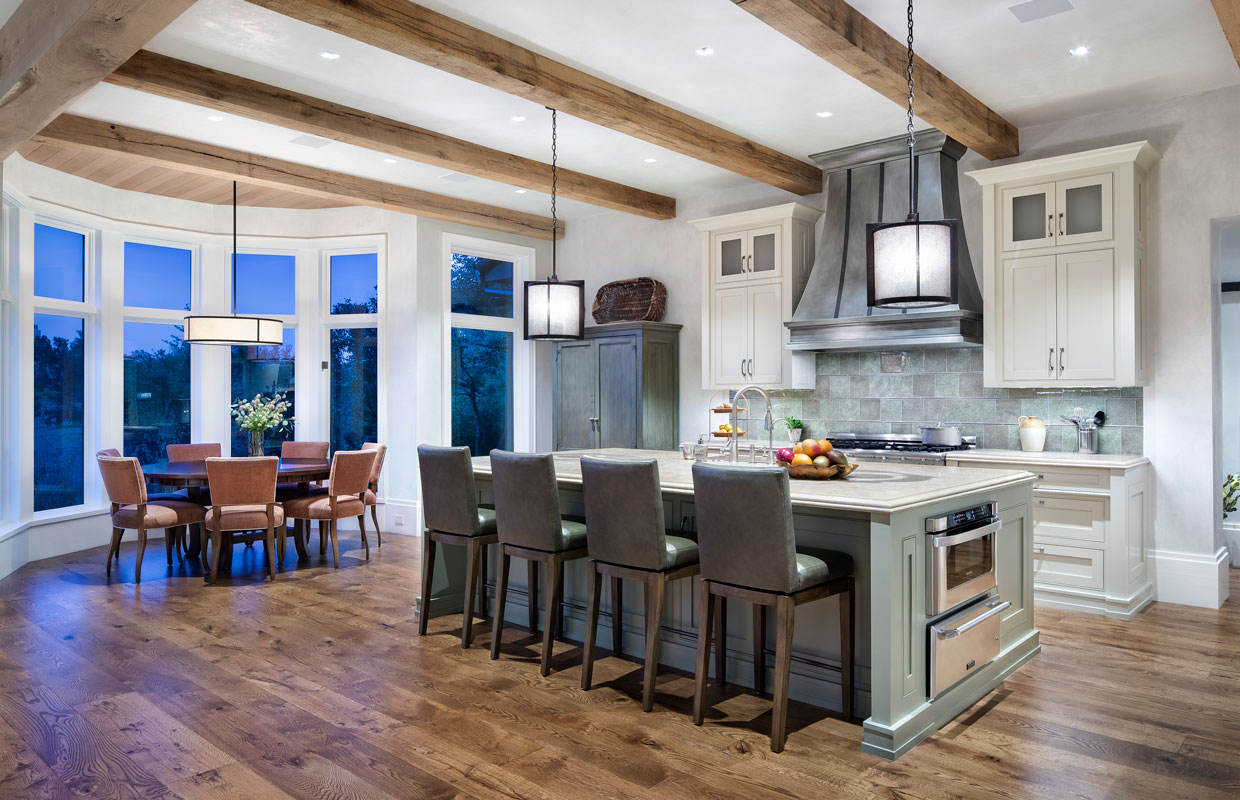 kitchen and dining room of a large home with exposed beams