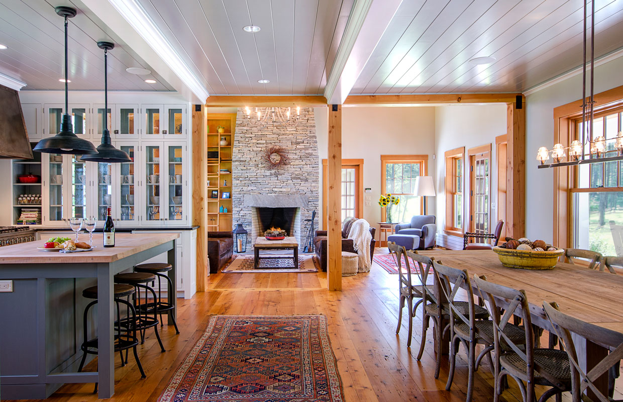 kitchen and dining room with a fireplace in the background