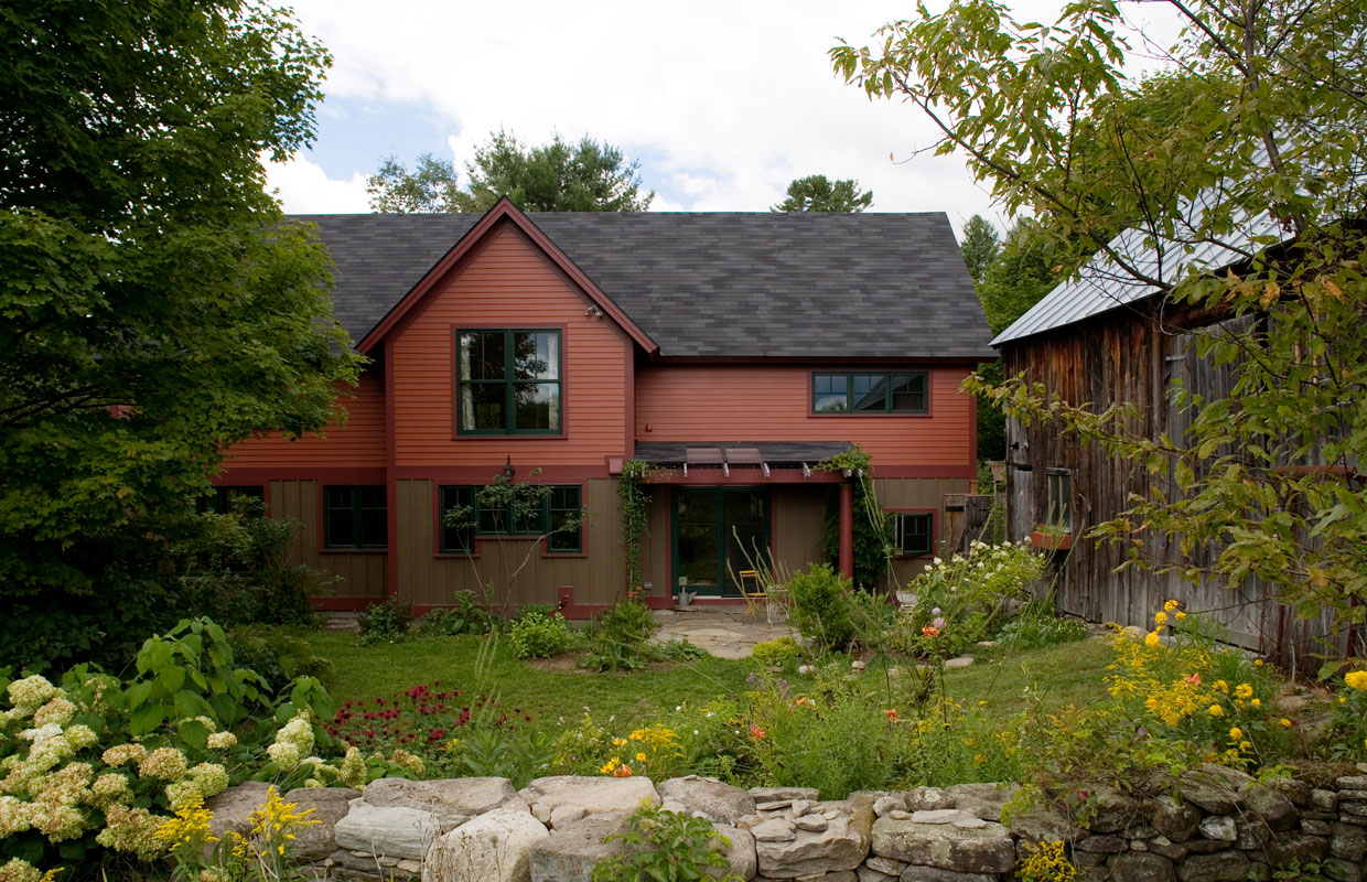 brown house with stonewall