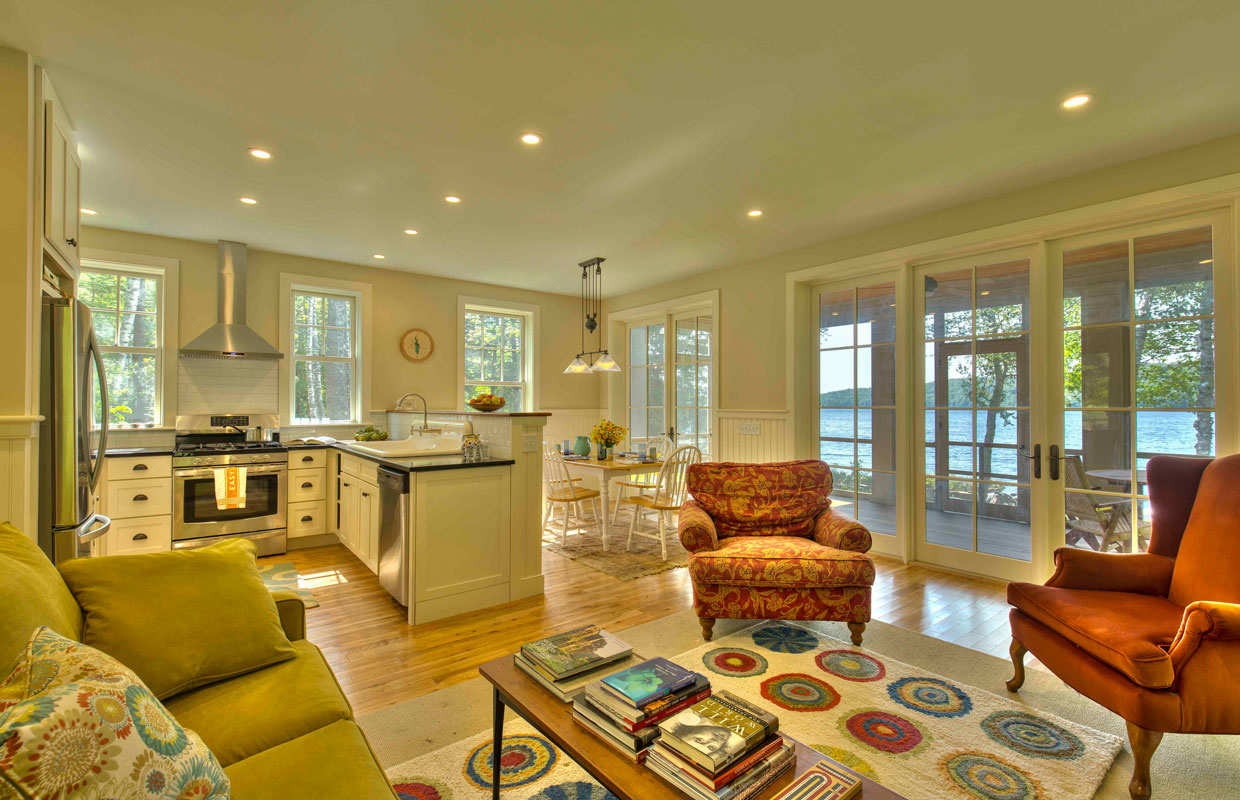 kitchen and dining room view with a lake view outside in the background