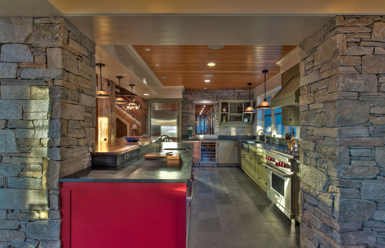 large kitchen with lots of stone accents