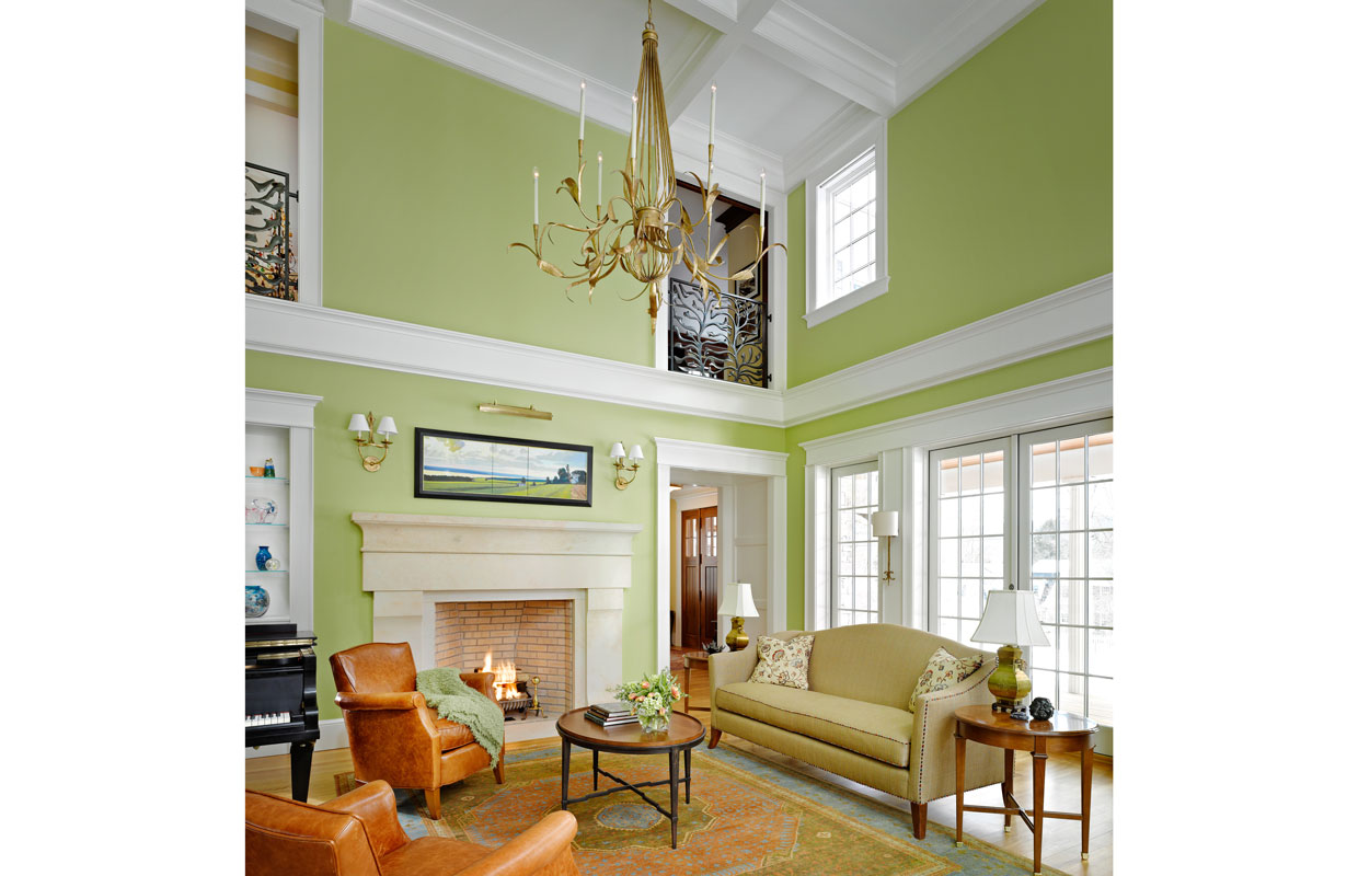 great room with sea moss green paint and lots of light