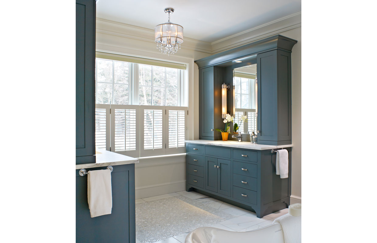 dark greenish blue vanity in a bathroom