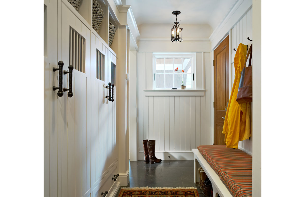 white clapboard mudroom