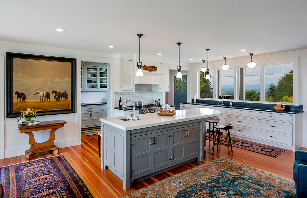 large kitchen with wood floors and a big island