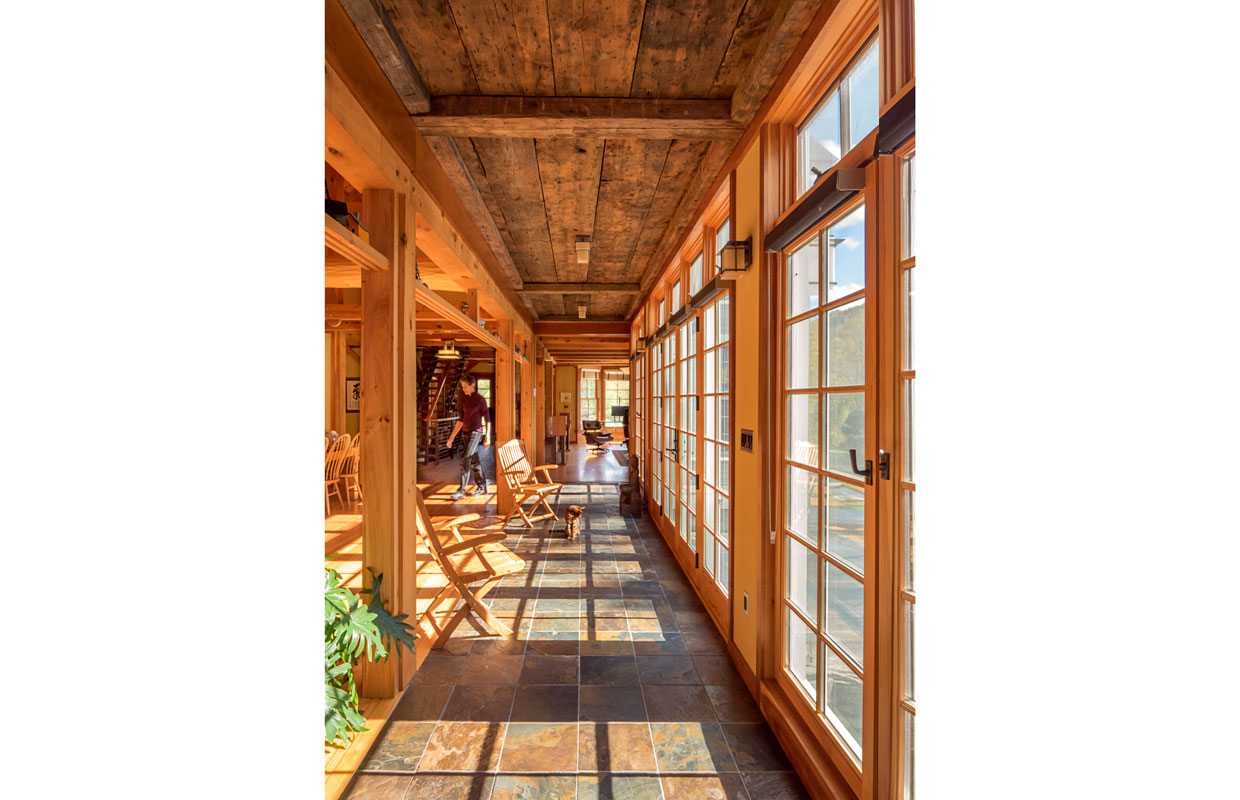 long corridor of windows and a tile floor