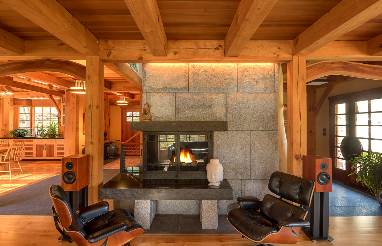 stone fireplace and leather chairs with an in-house sound system